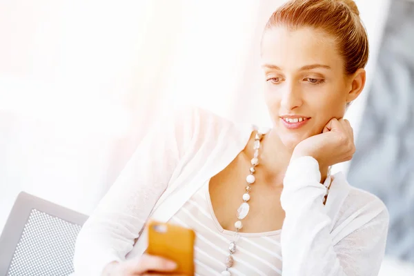 Attractive office worker sitting at desk — Stock Photo, Image