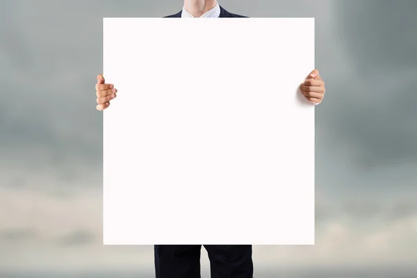 Businessman showing empty banner — Stock Photo, Image