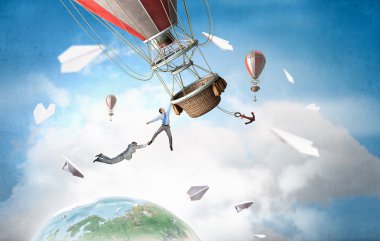 İş adamları balon üzerinde uçmak