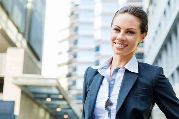 Portrait of business woman smiling outdoor Stock Picture