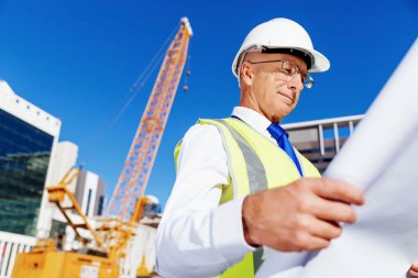 Engineer builder at construction site clipart
