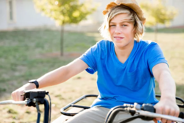 Boy riding farm truck in vineyard — Stock Photo, Image