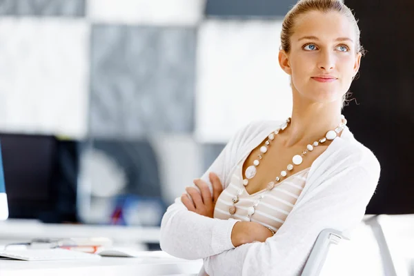 Attractive office worker sitting at desk — Stock Photo, Image