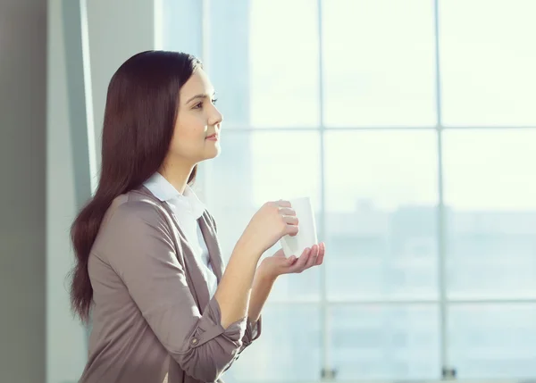 Attractive woman in office building — Stock Photo, Image