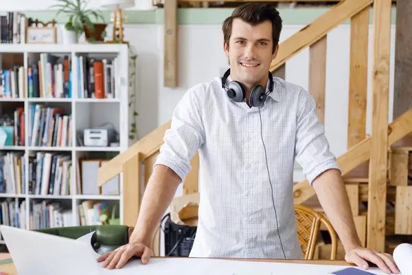 Young man standing in creative office — Stock Photo, Image