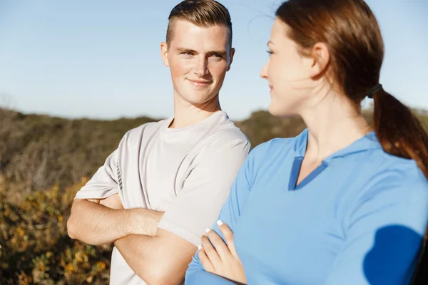 Young couple on beach training together — Stock Photo, Image
