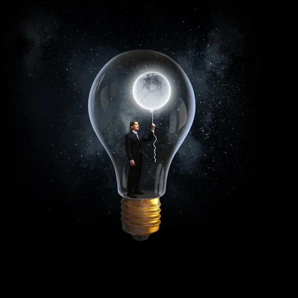 Man in elektrische lamp — Stockfoto