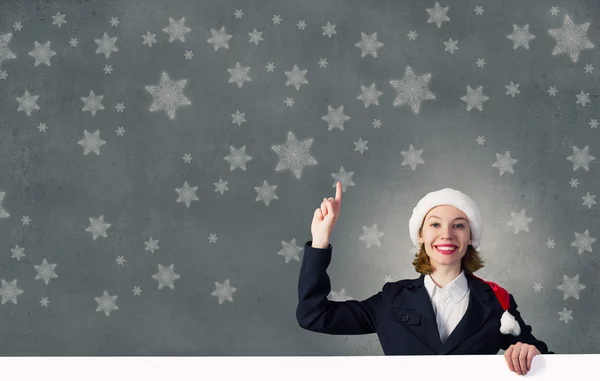 Santa vrouw met banner — Stockfoto