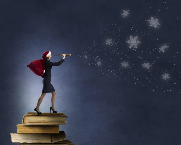 Santa woman with spyglass — Stock Photo, Image