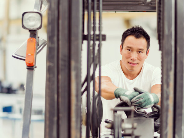 Asian worker in production plant on the factory floor