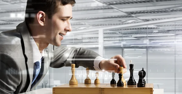 Playing his business strategy — Stock Photo, Image