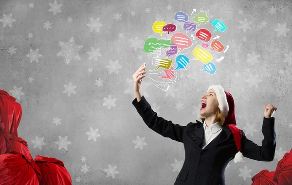 Santa woman with mobile phone — Stock Photo, Image