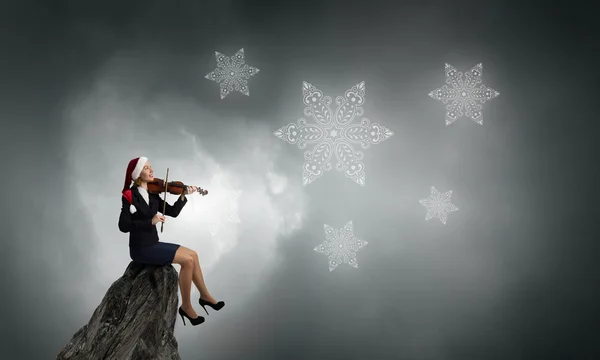 Santa woman play violin — Stock Photo, Image