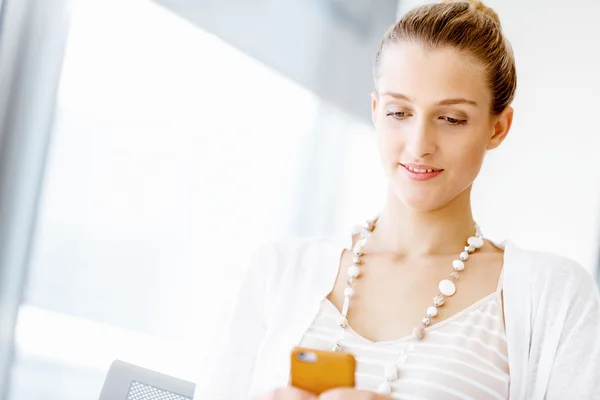 Attractive office worker sitting at desk — Stock Photo, Image