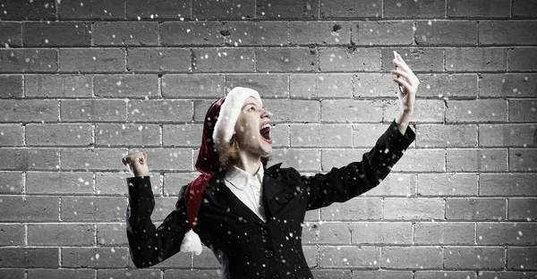 Santa žena s mobilním telefonem — Stock fotografie