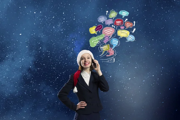 Santa mujer con teléfono móvil —  Fotos de Stock