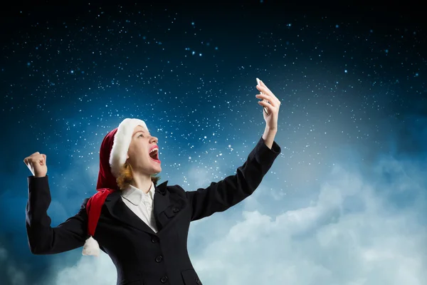Santa femme avec téléphone portable — Photo