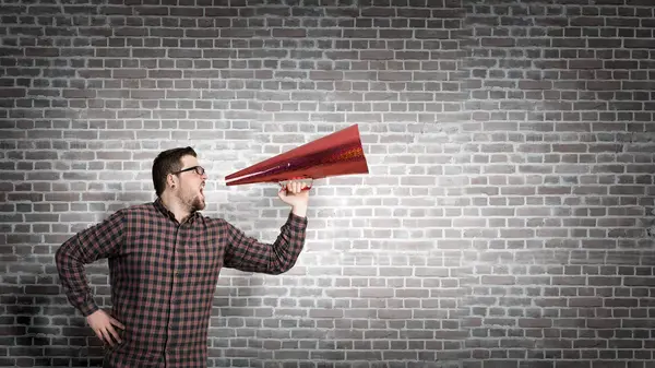 Guy make announcement in trumpet — Stock Photo, Image