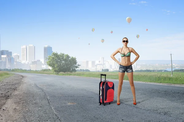 Hitch hiker woman on road — Stock Photo, Image