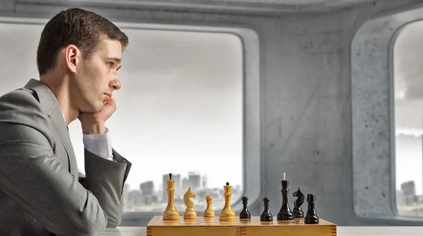 Playing his business strategy — Stock Photo, Image