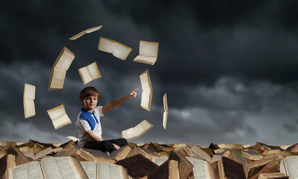 School boy among books — Stock Photo, Image