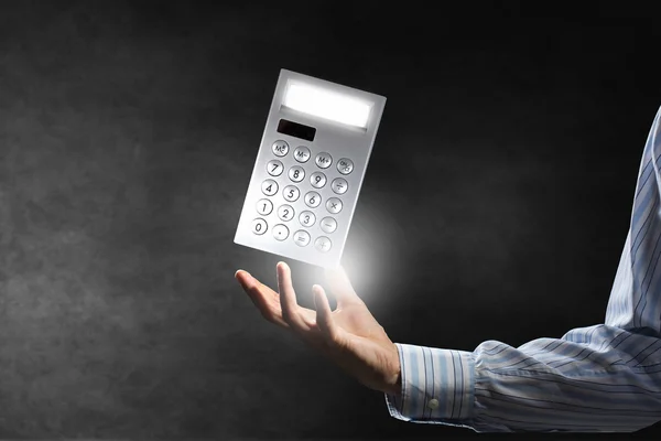 Calculator in palm — Stockfoto