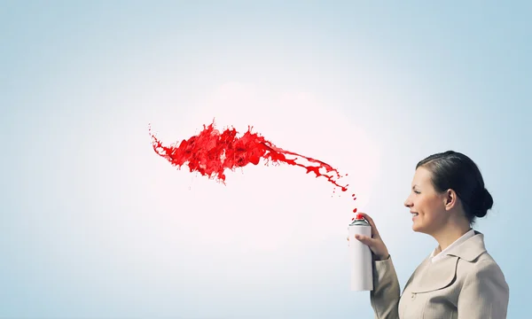 Woman use paint spray — Stock Photo, Image