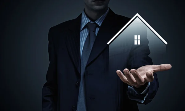 House sign in male hand — Stock Photo, Image