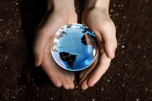 Digital globe in palms — Stock Photo, Image