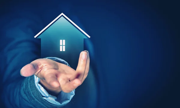 House sign in male hand — Stock Photo, Image