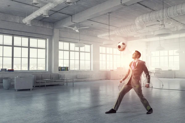 Playing football in office — Stock Photo, Image