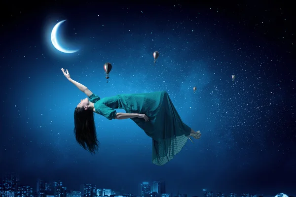 Woman in night sky — Stock Photo, Image