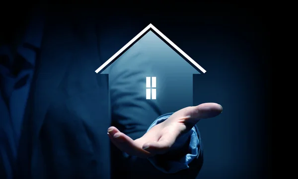 House sign in male hand — Stock Photo, Image