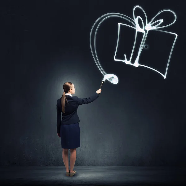 Woman drawing with lantern light — Stock Photo, Image