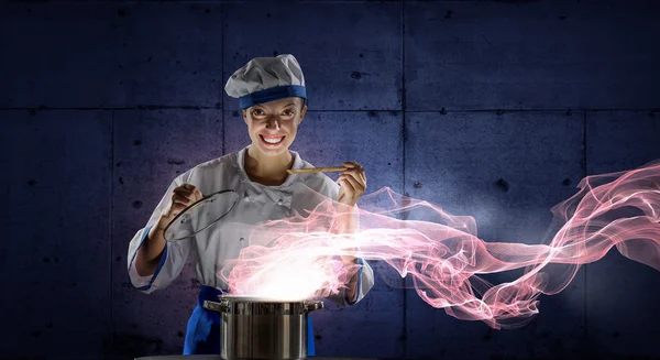 She is magician as cook — Stock Photo, Image