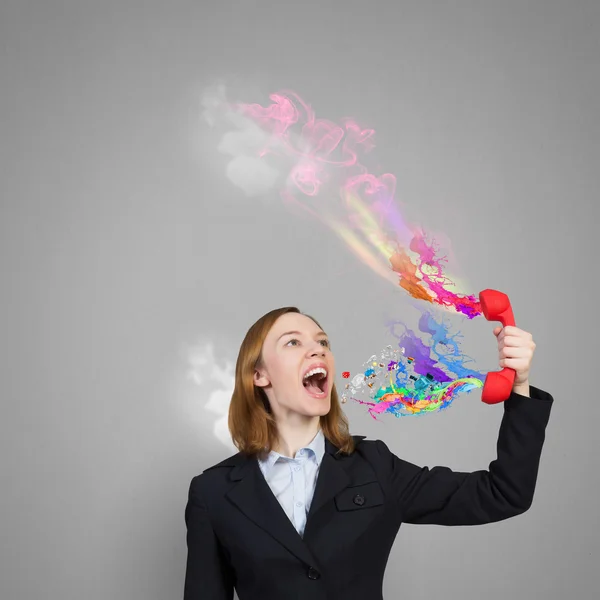 Mujer gritar en rojo receptor —  Fotos de Stock