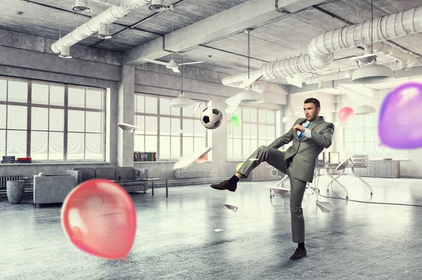 Playing football in office — Stock Photo, Image