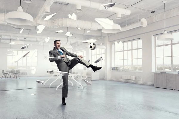 Playing football in office — Stock Photo, Image