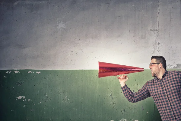 Guy make announcement in trumpet — Stock Photo, Image