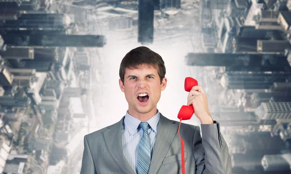 Empresário com receptor vermelho — Fotografia de Stock