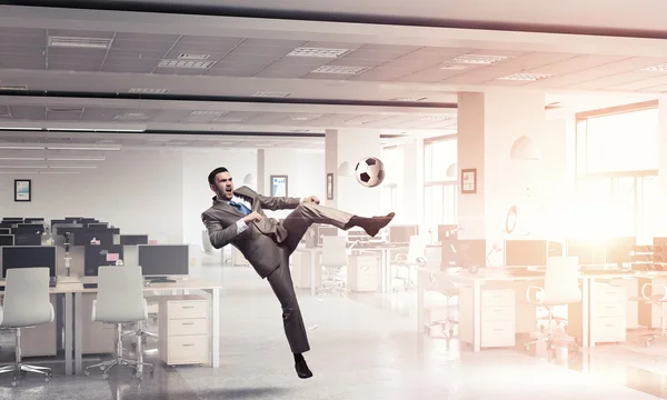 Playing football in office — Stock Photo, Image