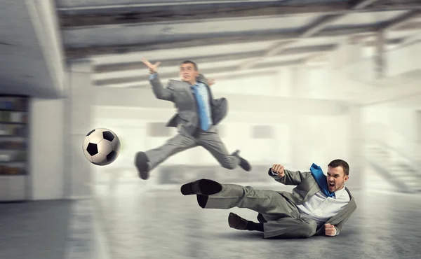 Playing football in office — Stock Photo, Image