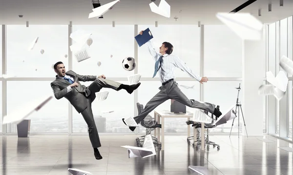 Playing football in office — Stock Photo, Image