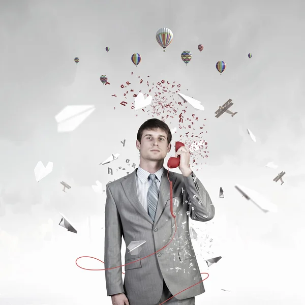 Businessman with red receiver — Stock Photo, Image