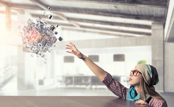 Hipster girl looking from under table — Stock Photo, Image