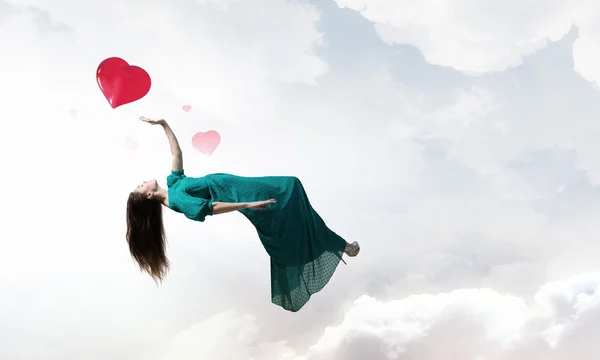 Woman floating in sky — Stock Photo, Image