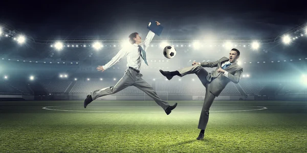 Two businessmen fight for ball — Stock Photo, Image