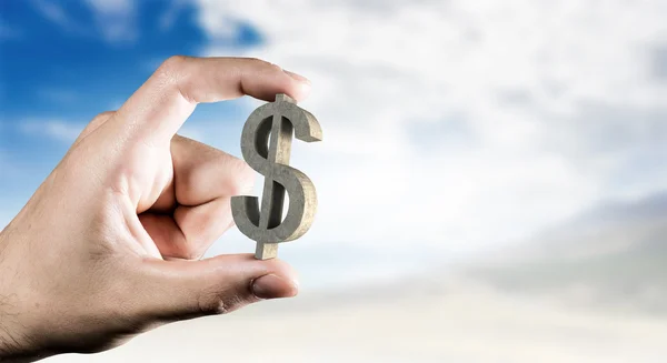 Money symbol between fingers — Stock Photo, Image