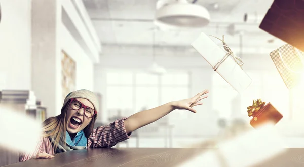 Hipster girl looking from under table — Stock Photo, Image