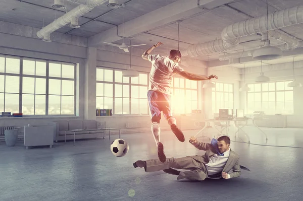 Playing football in office — Stock Photo, Image